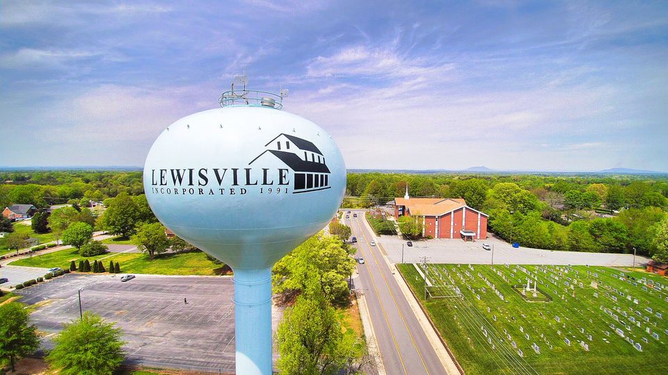 Lewisville NC Water Tower Against Blue Sky